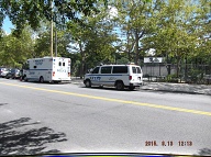A Large Empty NYPD Van Up Front!! An Officer Occupied NYPD Van Behind It!!