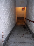 THESE ARE THE STAIRS FROM THE OUTSIDE TO THE GROUND FLOOR THE SURFACES EVERYWHERE  ARE ALL COVERED WITH THE  VILE RANTINGS OF THE LOST SOULS THAT FREQUENT THIS HELLHOLE!!